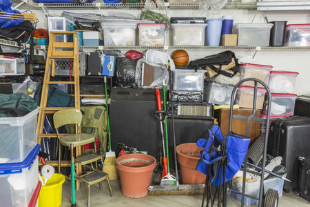 53109810 - garage filled with various home storage items.